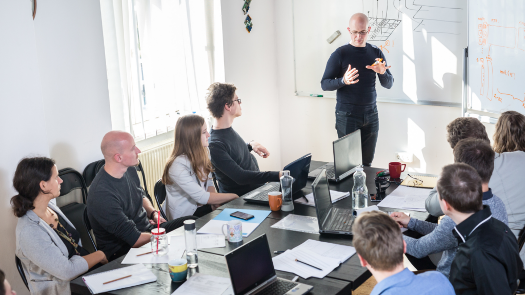 Property Managers are meeting with a property management coach. 